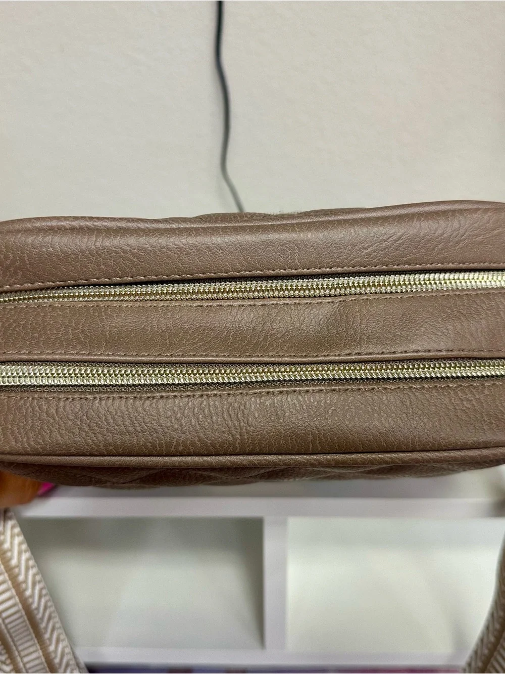 Itzy Ritzy Quilted Crossbody Bag in Taupe with Woven Strap